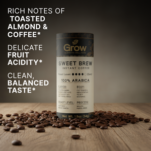 Grow Sweet Brew instant coffee canister with roasted almonds and coffee beans on a wooden surface