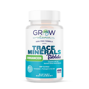 A bottle of Grow Vitamin Trace Minerals Enhanced Tablets, with the label indicating that they are a dietary supplement and have 100 tablets inside.