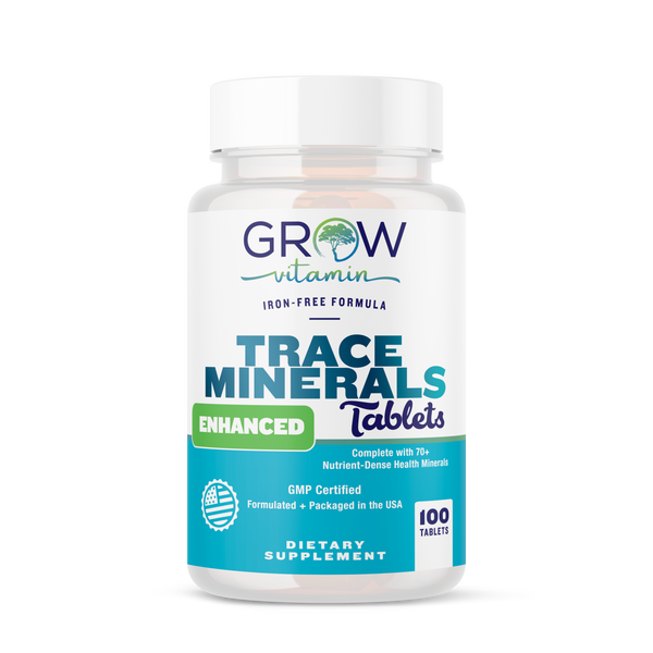A bottle of Grow Vitamin Trace Minerals Enhanced Tablets, with the label indicating that they are a dietary supplement and have 100 tablets inside.